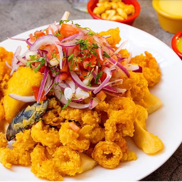 Don Pollo's Jalea Mixta, a Peruvian fried seafood platter with red onion salsa.